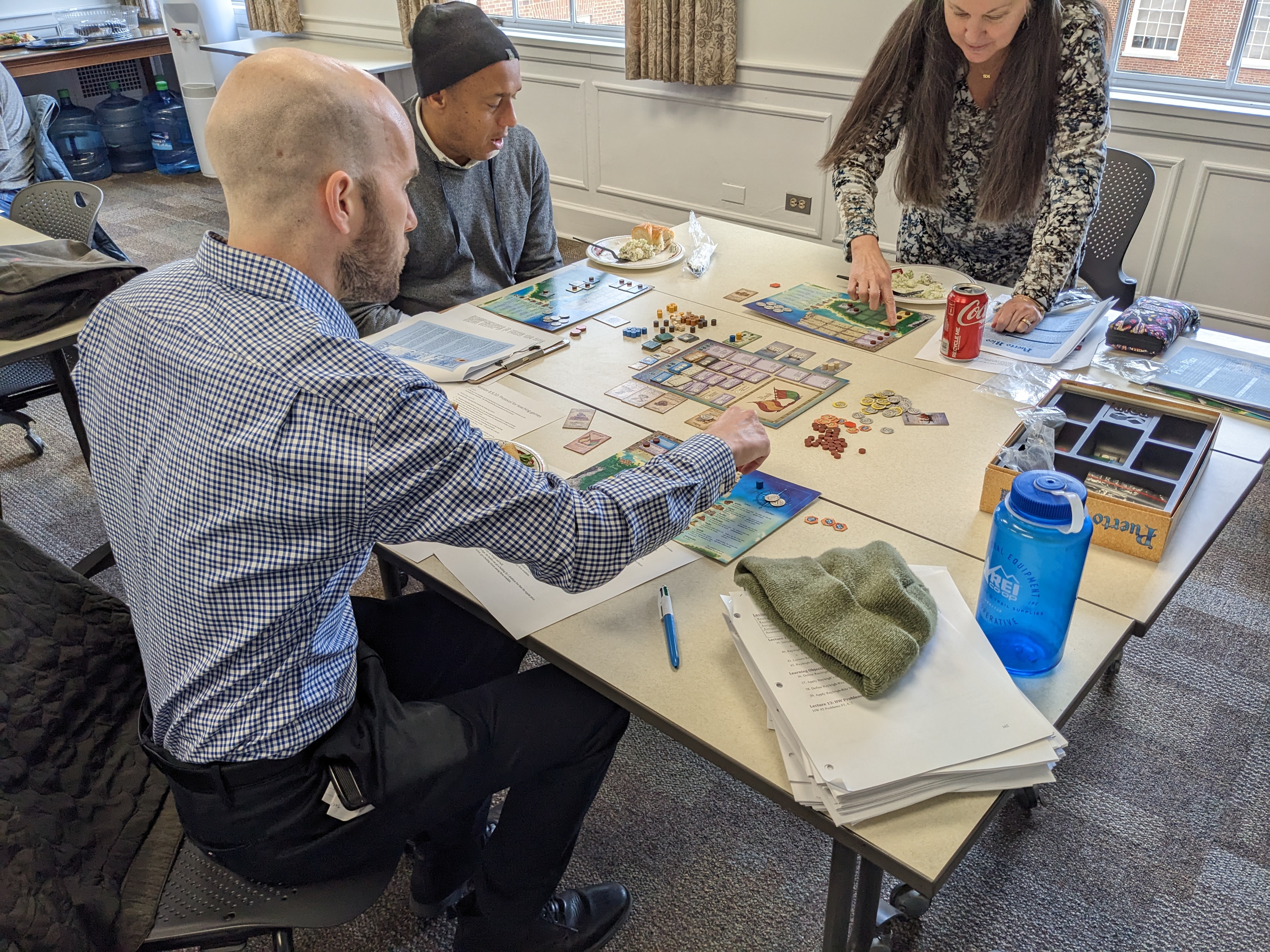 people playing a tabletop game